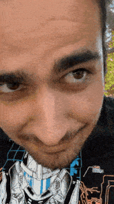 a close up of a man 's face wearing a shirt that says ' halo ' on it