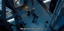we got new uniforms and lovely uniforms they are captain very colorful christopher pike anson mount saru