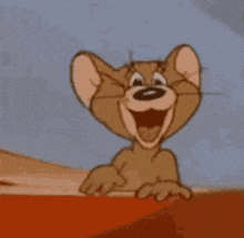 jerry from tom and jerry is smiling and pointing his finger .