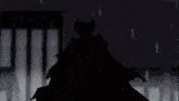 a silhouette of a devil with horns in front of a red background