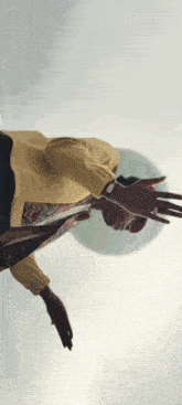 a person is flying through the air with their hands outstretched