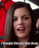 a woman with long hair is smiling and says `` i thought chivalry was dead '' .