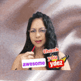 a woman with glasses holds a pencil and a sign that says awesome
