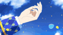 a person 's hand is reaching up towards the sky