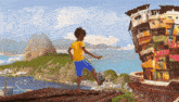 a boy in a yellow shirt is kicking a soccer ball in front of a building that says ' paty ' on it