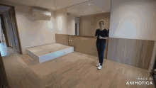 a woman standing in a room with the words made in animatica on the bottom