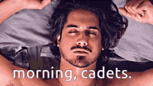a man laying in bed with his eyes closed and the words morning cadets