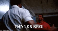 two men are standing next to each other and one of them says thanks bro .