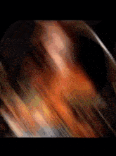 a blurred image of a person 's face with a dark background