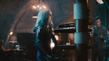 a person is hitting a wooden dummy with a hammer