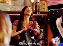 a woman is sitting in a chair with her eyes closed and says " oh no no no no "