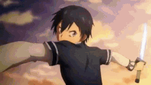 a young boy is holding a sword in his hand .