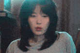 a woman yawning with her eyes closed and her mouth wide open