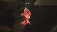 a pink and purple cartoon character is flying through the air in a video game .