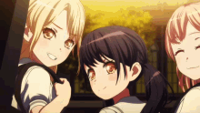 three anime girls are posing for a picture and one of them is smiling