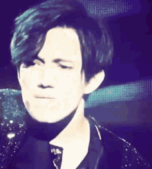 a close up of a man making a funny face .