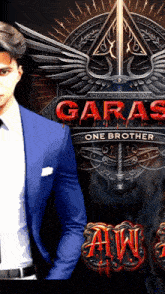 a man in a blue suit and tie stands in front of a poster for garas one brother