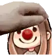 a close up of a cartoon character with a clown nose and a hat on .