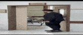 a man in a suit is walking through a doorway with a sign on the wall that says " e-office "