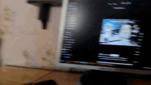 a computer monitor shows a blurry image of a person