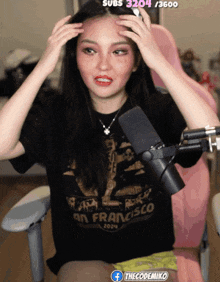 a woman wearing a black shirt that says san francisco