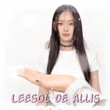 a woman with long hair is wearing a choker and a white shirt and holding her hand out .
