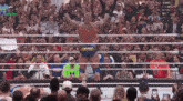 a man in a wrestling ring with a sign that says shaw