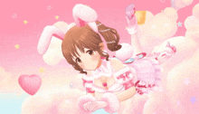 a girl in a bunny costume is laying on a pink cloud