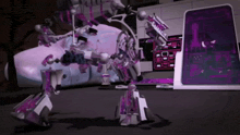 a purple and white robot is standing in front of a computer screen that says ' e-mail ' on it