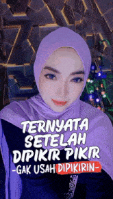 a woman wearing a purple hijab with ternyata setelah dipikir pikir