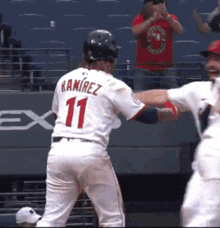 a baseball player with ramirez 11 on his back