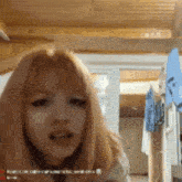 a blurred image of a woman with pink hair