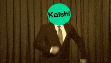a man in a suit and tie is standing in front of a curtain that says let 's go