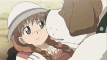 a little girl is laying on the ground with a dog