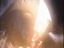 a close up of a person 's face with a glowing light coming out of it