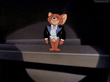 a cartoon of jerry in a tuxedo stands on a stage with a microphone in his hand