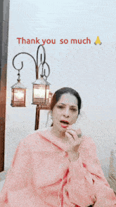 a woman in a pink dress is wearing headphones and a ring and says thank you so much
