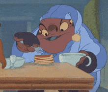 a cartoon character is sitting at a table with pancakes and a cup of coffee