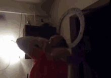 a person is standing in front of a mirror .