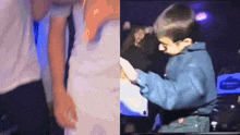 a man in a white shirt and a boy in a blue jacket are standing next to each other on a stage .