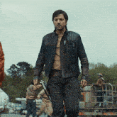 a man in a leather jacket is walking down a street with the word kepler in the corner