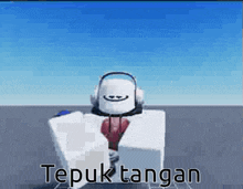 a robot wearing headphones and a tie is standing on a gray surface .