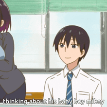 a man in a white shirt and blue tie is talking about his baby boy mikey