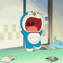 doraemon is standing on a green carpet with his mouth open