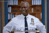 a police officer says forced laughing while wearing a white uniform and tie