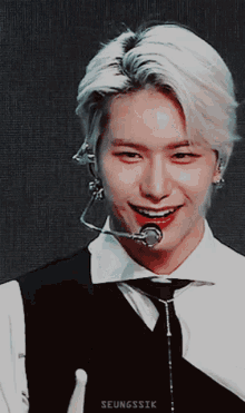 a close up of a person with the name seungssik on the bottom right