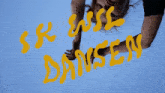 a woman is looking up at the words i rk will dansen in yellow letters