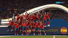 a group of soccer players are posing for a photo with a sign that says euro2024