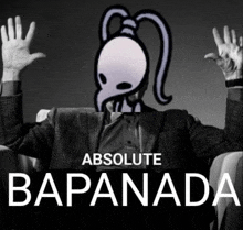 a man in a suit is sitting in front of a poster that says absolute bapanada on it