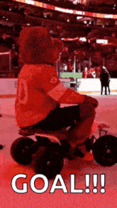 a mascot is riding a toy motorcycle on the ice at a hockey game .